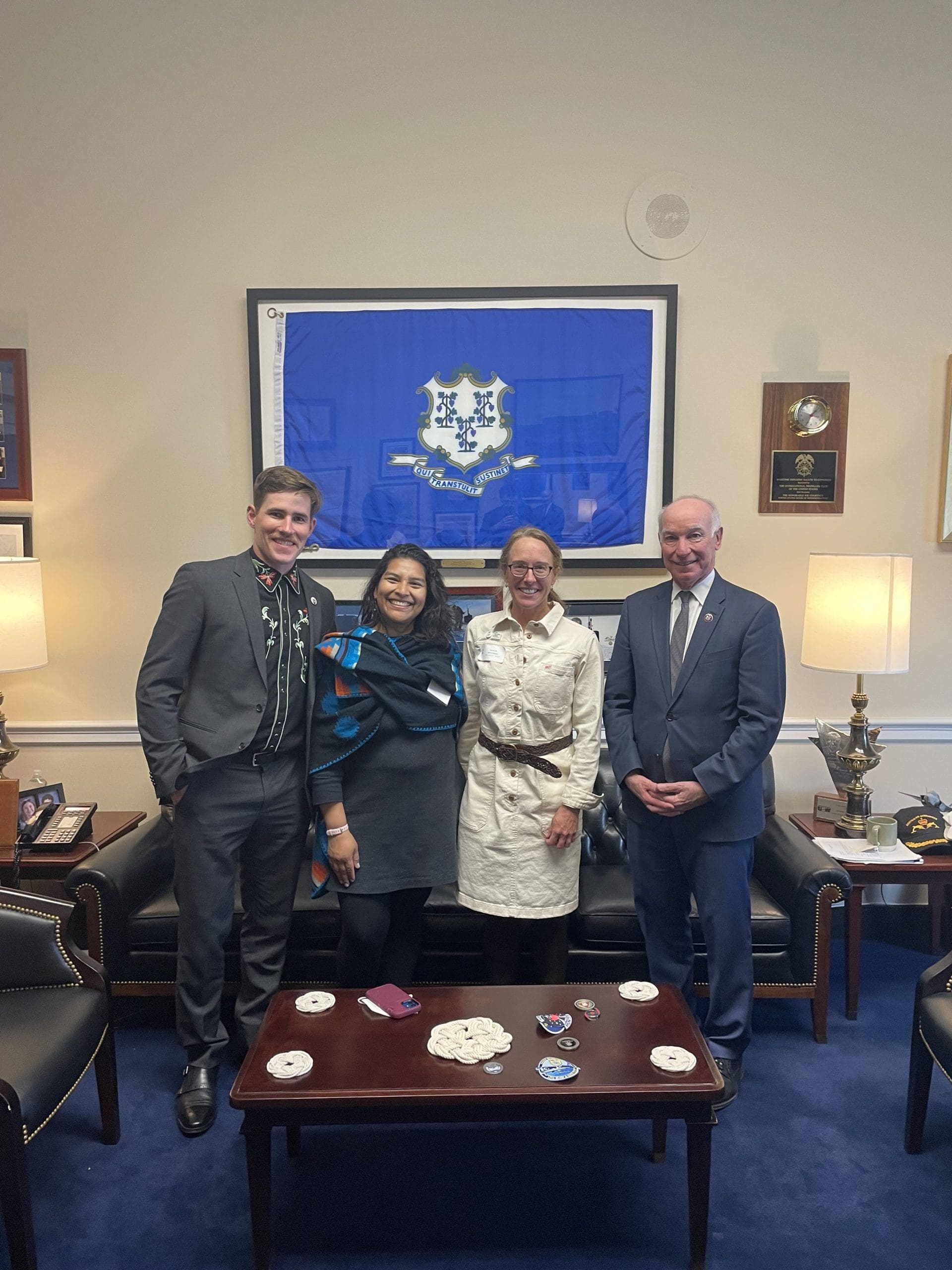 Will O'Meara stands next to Elizabeth Guerra of Seamarron Farmstead, Susan Mitchell of Cloverleigh Farm, and Representative Courtney in Representative Courtney's office in D.C.